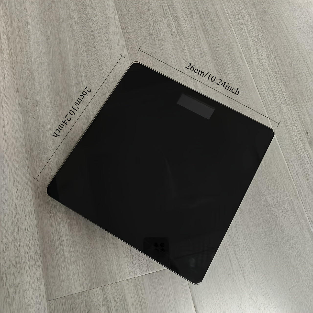 A Smart Digital Bathroom Scale, a Household Item, an Electronic Scale for Home Use, a Small Tempered Glass Scale for Domestic Use.